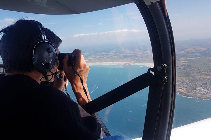 Fly above Normandy's hallowed coastline in a private plane