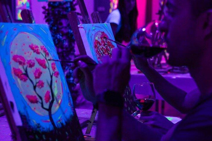 Paint a neon fluorescent picture while drinking unlimited wine